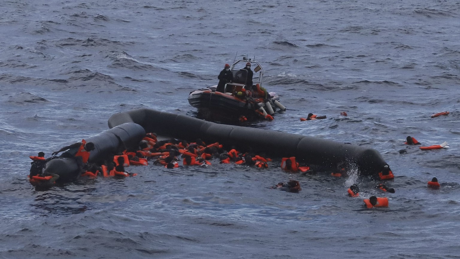 Refugees and migrants are rescued by members of the Spanish NGO Proactiva Open Arms, after leaving Libya trying to reach European soil aboard an overcrowded rubber boat in the Mediterranean sea, Wedne ...