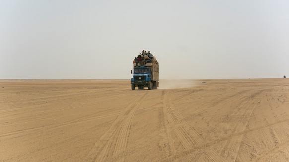 A truck carrying goods and migrants drives through Niger&#039;s Tenere desert region of the south central Sahara on Sunday, June 3, 2018. Once a well-worn roadway for overlander tourists, the highway’ ...