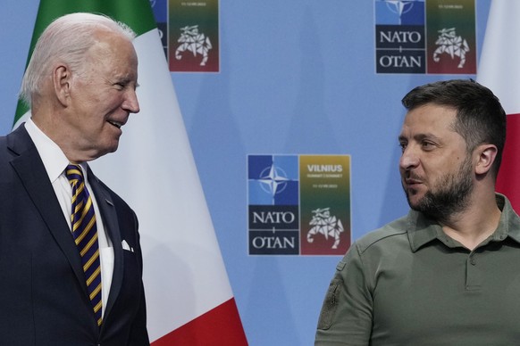President Joe Biden, left, and Ukraine&#039;s President Volodymyr Zelenskyy, talk on stage during an event with G-7 leaders on the sidelines of the NATO summit in Vilnius, Lithuania, Wednesday, July 1 ...