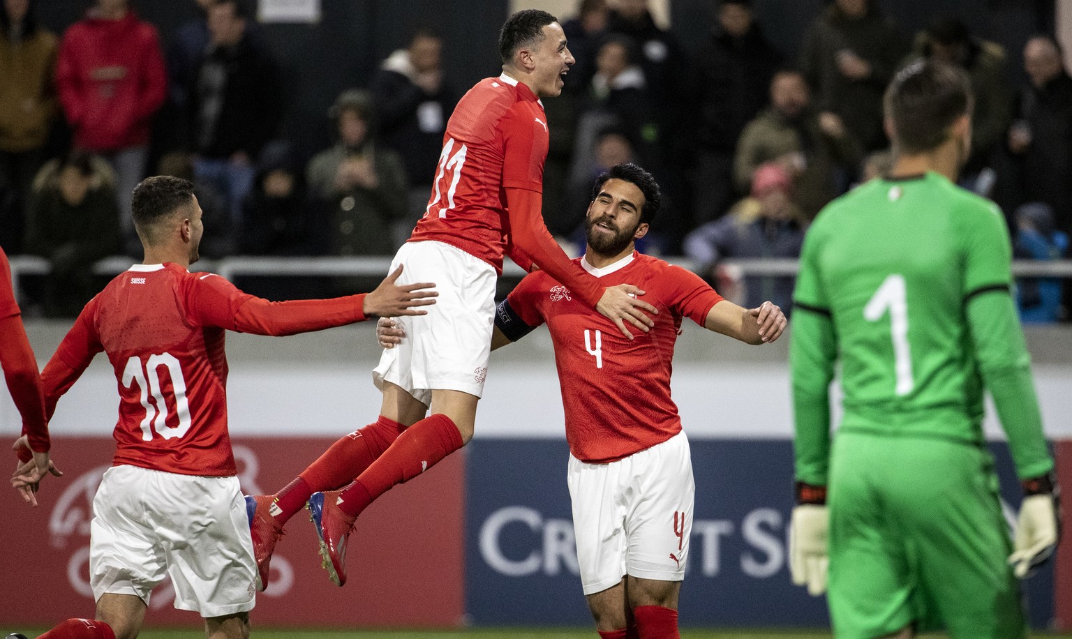 Switzerland&#039;s Nedim Bajrami, Switzerland&#039;s Ruben Vargas and Switzerland&#039;s Eray Coemert, from left, celebrate during a friendly international U-21 soccer match between Switzerland and It ...