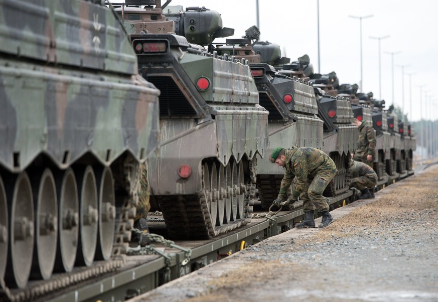 epa05806800 German army tanks of type &#039;Marder&#039; are loaded onto a train for transport to Lithuania at the military training area in Grafenwoehr, Germany, 21 February 2017. Germany will deploy ...
