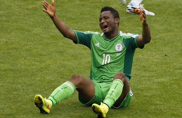 Nigeria&#039;s John Obi Mikel calls for a foul after falling during their 2014 World Cup Group F soccer match against Argentina at the Beira Rio stadium in Porto Alegre June 25, 2014. REUTERS/Marko Dj ...