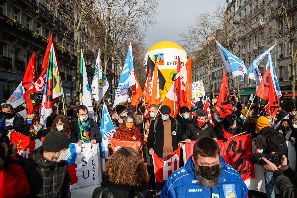 epa09682924 Teachers attend a rally during a nationwide strike over coronavirus measures in schools, in Paris, France, 13 January 2022. Tens of thousands of teachers all over France took to the street ...