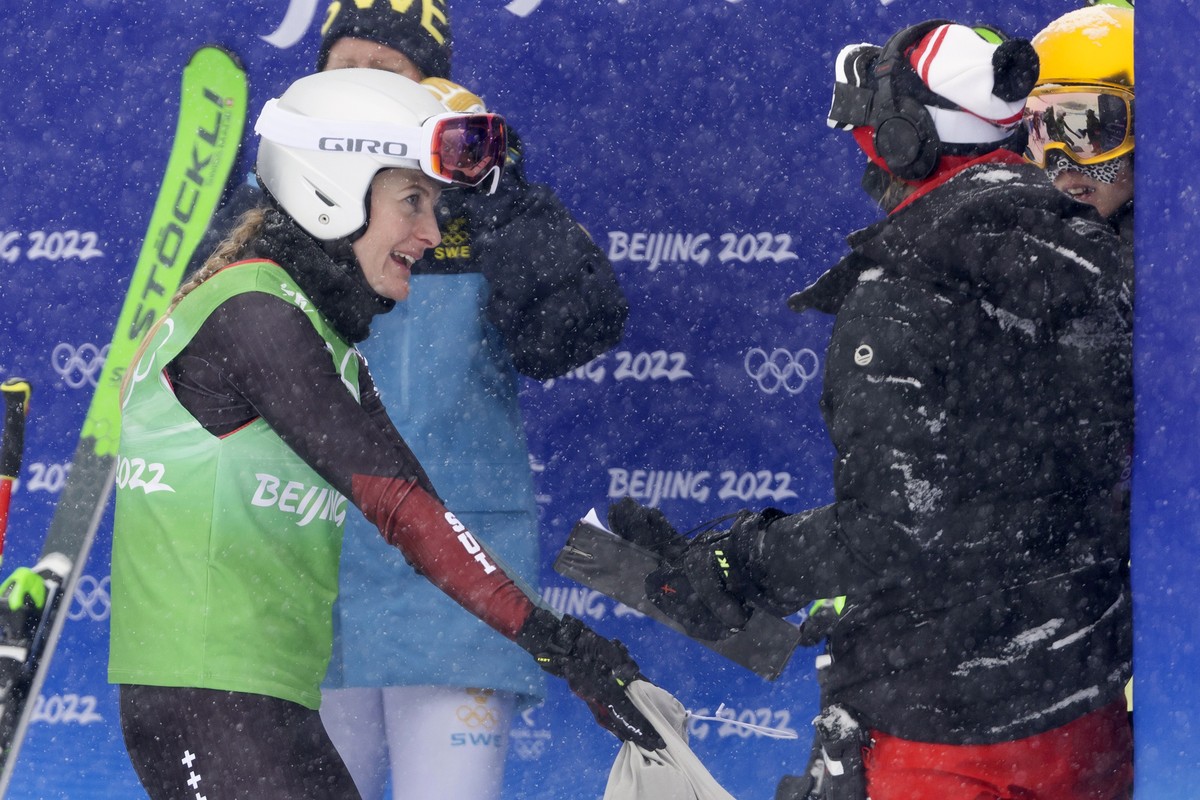 Fanny Smith of Switzerland, center, discusses with an official and Germany's Daniela Maier, back right, after the big final run at the women's ski freestyle cross competition at the 2022 Win ...