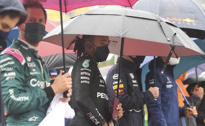 epa09435219 British Formula One driver Lewis Hamilton (C) of Mercedes-AMG Petronas on the grid before the start of the Formula One Grand Prix of Belgium at the Spa-Francorchamps race track in Stavelot ...