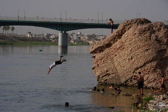 Hot weather in Iraq BAGHDAD, IRAQ - JULY 30: A child jumps into the Tigris River to cool off amid extreme heat in Baghdad, Iraq, on July 30, 2025. Murtadha Al-Sudani / Anadolu Baghdad Iraq. Editorial  ...