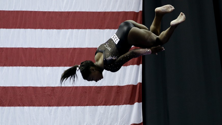 Simone Biles competes in the beam during the senior women&#039;s competition at the 2019 U.S. Gymnastics Championships Sunday, Aug. 11, 2019, in Kansas City, Mo. (AP Photo/Charlie Riedel)