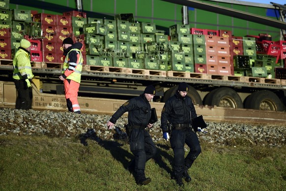 epa07258533 Members of the Danish emergency services at the scene following a train accident where six passengers died and at least 16 were injured at the Great Belt bridge between the Danish islands  ...