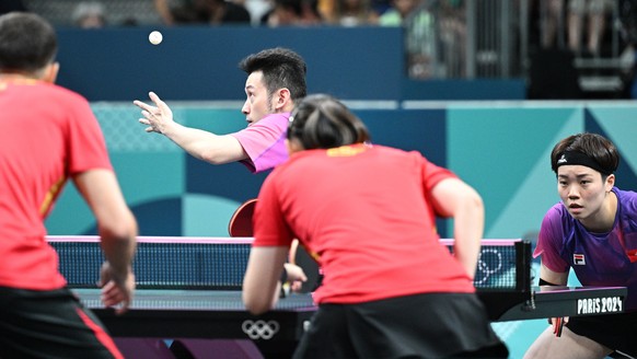 epa11503149 Wong Chun Ting and Doo Hoio Kem of Hong Kong compete during their Mixed Doubles Quarterfinal of the Table Tennis competitions in the Paris 2024 Olympic Games, at The South Paris Arena in P ...