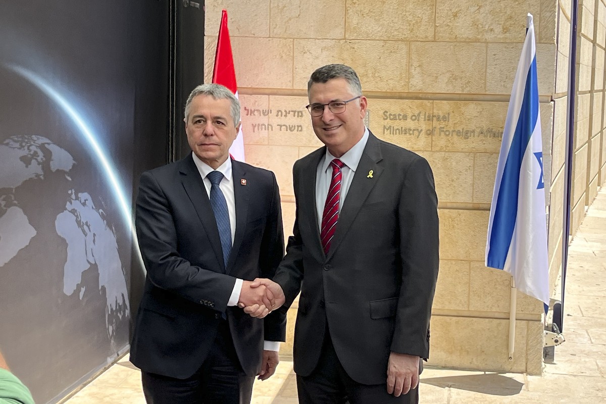 Switzerland's Foreign Minister Federal Councillor Ignazio Cassis, left, shakes hands with Israel's Foreign Minister Gideon Sa'ar, right, in Jerusalem, Israel, Wednesday, June 11, 2025.  ...
