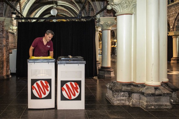 epa11391109 A worker moves ballot boxes as a polling station is being built in the &#039;Posthoornkerk&#039; (Post Horn Church) in Amsterdam, The Netherlands, 05 June 2024. On 06 June the Netherlands  ...
