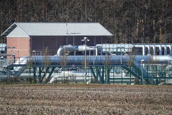 epa09812313 Installations at the premises of the Astora reservoir for natural gas in Rehden, northern Germany, 09 March 2022. With a storage capacity of 3.9 billion cubic meters, the Rehden storage fa ...