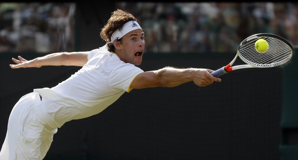 Austria&#039;s Dominic Thiem returns to Canada&#039;s Vasek Pospisil during their Men&#039;s Singles Match on day two at the Wimbledon Tennis Championships in London Tuesday, July 4, 2017. (AP Photo/K ...