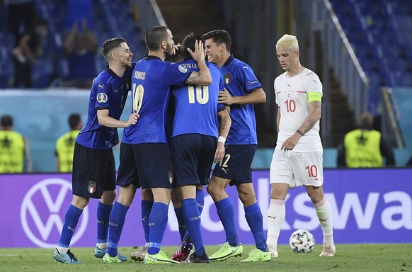 Italy&#039;s Ciro Immobile, covered by his teammates, celebrates after scoring his side&#039;s third goal during the Euro 2020 soccer championship group A match between Italy and Switzerland at Olympi ...