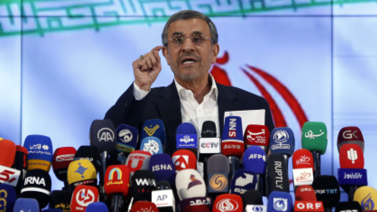 epa11385135 Former Iranian president Mahmoud Ahmadinejad talks to the media after registering his candidacy during the registration for the Iranian presidential election at the interior ministry in Te ...