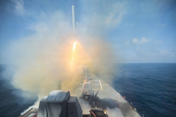 In this image provided by U.S. Central Command, the Arleigh Burke-class guided-missile destroyer USS Spruance (DDG 111) fires a Tomahawk Land Attack Missile (TLAM) in support of Operation Epic Fury, o ...