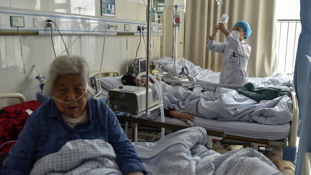 Elderly patients with COVID symptoms receive intravenous drips at the emergency ward of a hospital in Fuyang in central China's Anhui province on Jan. 4, 2023. China's healthcare authorities ...