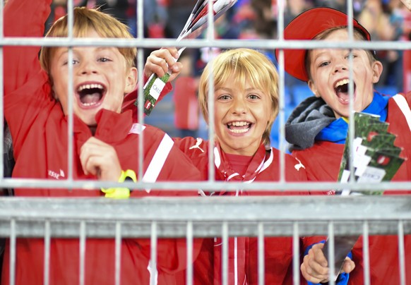 Kids cheer after Switzerland's Steven Zuber scored 4-0 during the 2018 Fifa World Cup Russia group B qualification soccer match between Switzerland and Hungary in the St. Jakob-Park stadium in Ba ...
