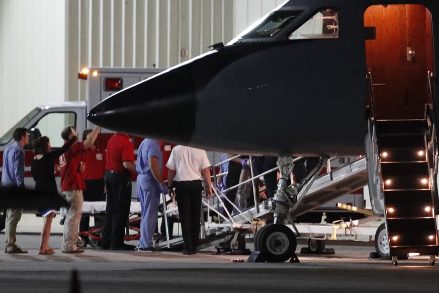 The legs of Otto Warmbier, a 22-year-old University of Virginia undergraduate student who was imprisoned in North Korea in March 2016, are seen as medical personnel transfer him from a transport aircr ...