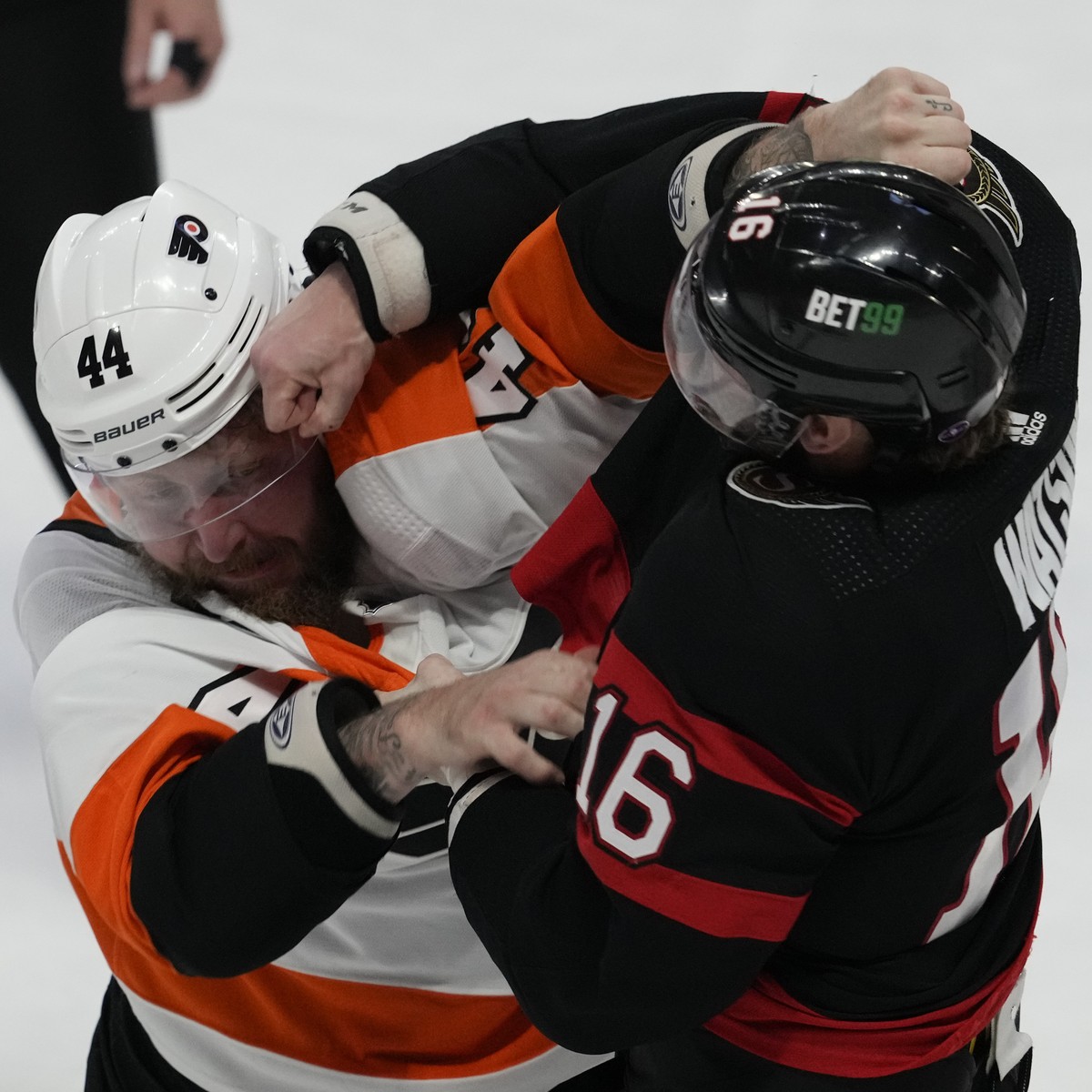 Ottawa Senators left wing Austin Watson (16) fights with Philadelphia Flyers left wing Nicolas Deslauriers (44) during second-period NHL hockey game action Thursday, March 30, 2023, in Ottawa, Ontario ...