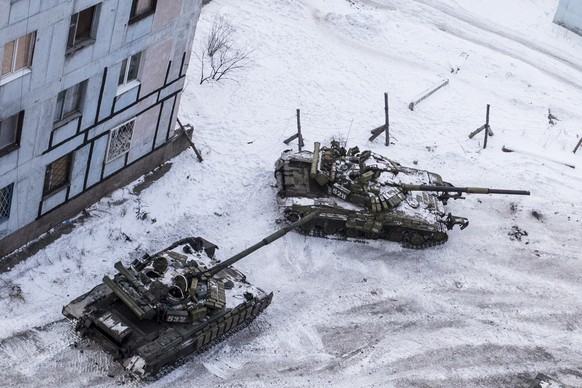 Ukrainian tanks stand in the courtyard of an apartment building in Avdiivka, eastern Ukraine, Wednesday, Feb. 1, 2017. Heavy fighting around government-controlled Avdiivka, just north of the rebel stronghold city of U...