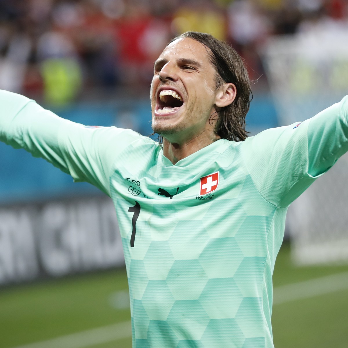 Switzerland's goalkeeper Yann Sommer celebrates saving the penalty kick of France's Kylian Mbappe during the Euro 2020 soccer championship round of 16 match between France and Switzerland at ...