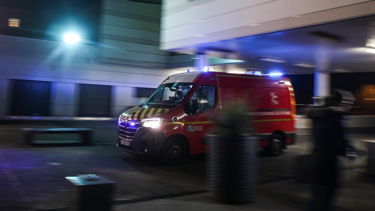 epa09601870 An ambulance arrives at the emergency entrance at Calais Hospital Center, in Calais, France, 24 November 2021. At least 31 migrants are dead and two more were brought to the hospital after ...