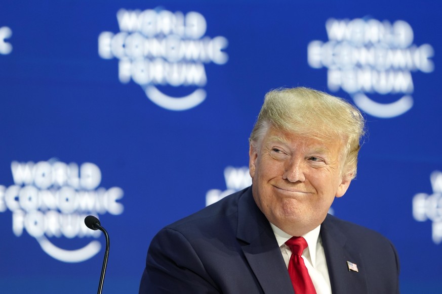 US President Donald Trump smiles prior to a plenary session of the World Economic Forum in Davos, Switzerland, Tuesday, Jan. 21, 2020. The 50th annual meeting of the forum will take place in Davos fro ...