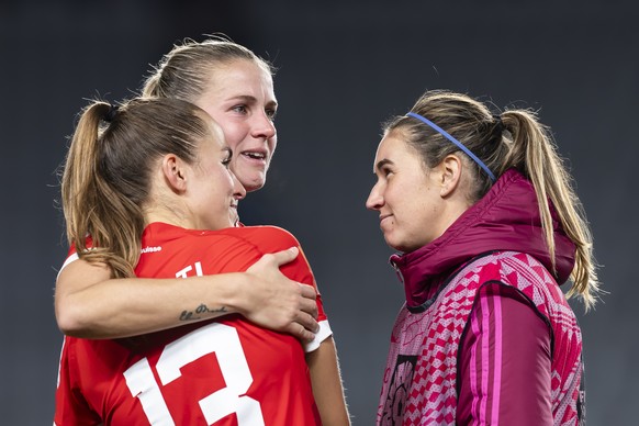 Switzerland&#039;s captain midfielder Lia Waelti, left, and forward Ana Maria Crnogorcevic, center, are consoled by Spain&#039;s forward Mariona Caldentey, right, after the team&#039;s 1-5 defeat and  ...