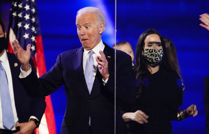 epa08806602 US President-elect Joe Biden reacts after delivering his victory address after being declared the winner in the 2020 presidential election in Wilmington, Delaware, USA, 07 November 2020. B ...