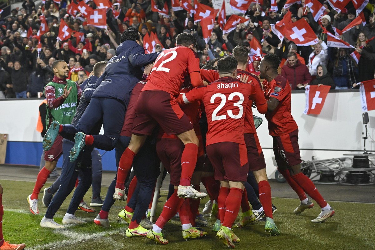 Switzerland's players celebrate the fourth goal that qualify them directly for the FIFA World Cup Qatar 2022 during the 2022 FIFA World Cup European Qualifying Group C match between Switzerland a ...