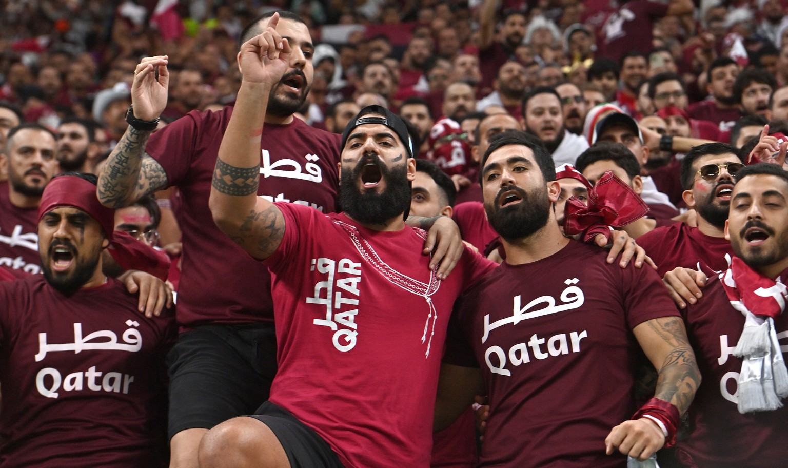epa10316242 Supporters of Qatar cheer during the FIFA World Cup 2022 group A Opening Match between Qatar and Ecuador at Al Bayt Stadium in Al Khor, Qatar, 20 November 2022. EPA/Noushad Thekkayil