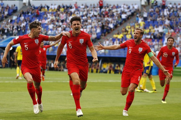 England&#039;s Harry Maguire, center, celebrates with his team mates after scoring his side opening goal during the quarterfinal match between Sweden and England at the 2018 soccer World Cup in the Sa ...