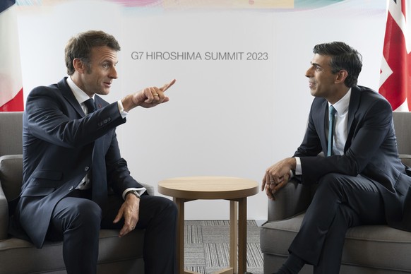British Prime Minister Rishi Sunak, right, meets with French President Emmanuel Macron during the G7 summit on Saturday, May 20, 2023 at the Grand Prince Hotel in Hiroshima, western Japan.  (Stefan Rou...