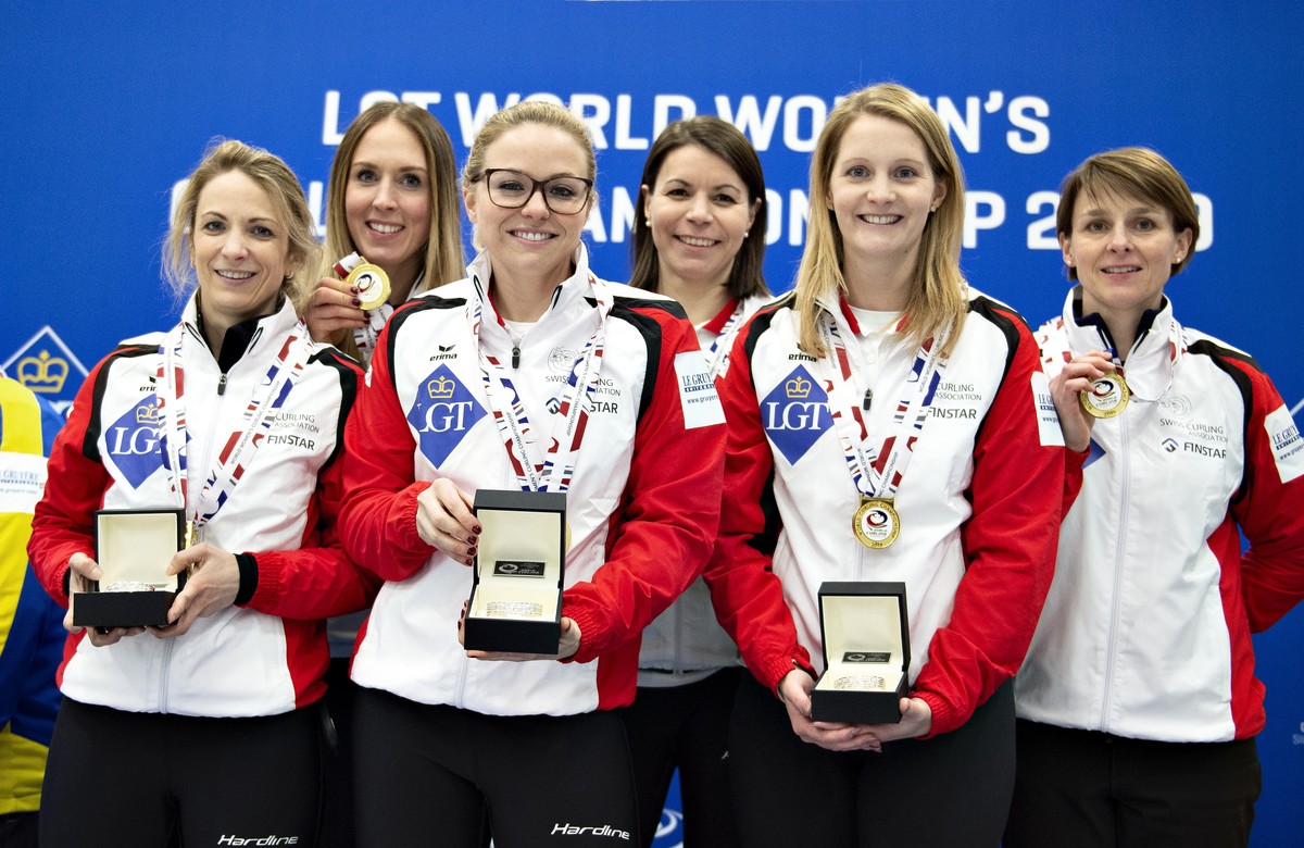 epa07460960 Switzerland's team pose whit medals after winning the gold match between Switzerland and Sweden during the Women's Curling World Championship in Silkeborg, Denmark, 24 March 2019 ...