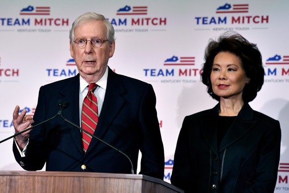 Senate Majority Leader Mitch McConnell, R-Ky., left, and his wife, Transportation Secretary Elaine Chao respond to a reporter's question during a press conference in Louisville, Ky., Wednesday, Nov. 4, 2020. McConnell secured a seventh term in Kentucky, fending off Democrat Amy McGrath. (AP Photo/Timothy D. Easley)