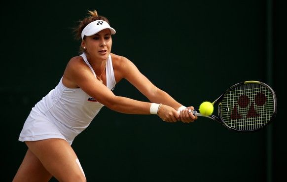 LONDON, ENGLAND - JULY 06: Belinda Bencic of Switzerland plays backhand in her Ladies&#039; Singles Fourth Round match against Victoria Azarenka of Belarus during day seven of the Wimbledon Lawn Tenni ...