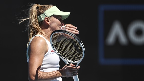 epa09694130 Jil Teichmann of Switzerland in action during her second round match against Victoria Azarenka of Belarus at the Australian Open Grand Slam tennis tournament in Melbourne, Australia, 19 Ja ...