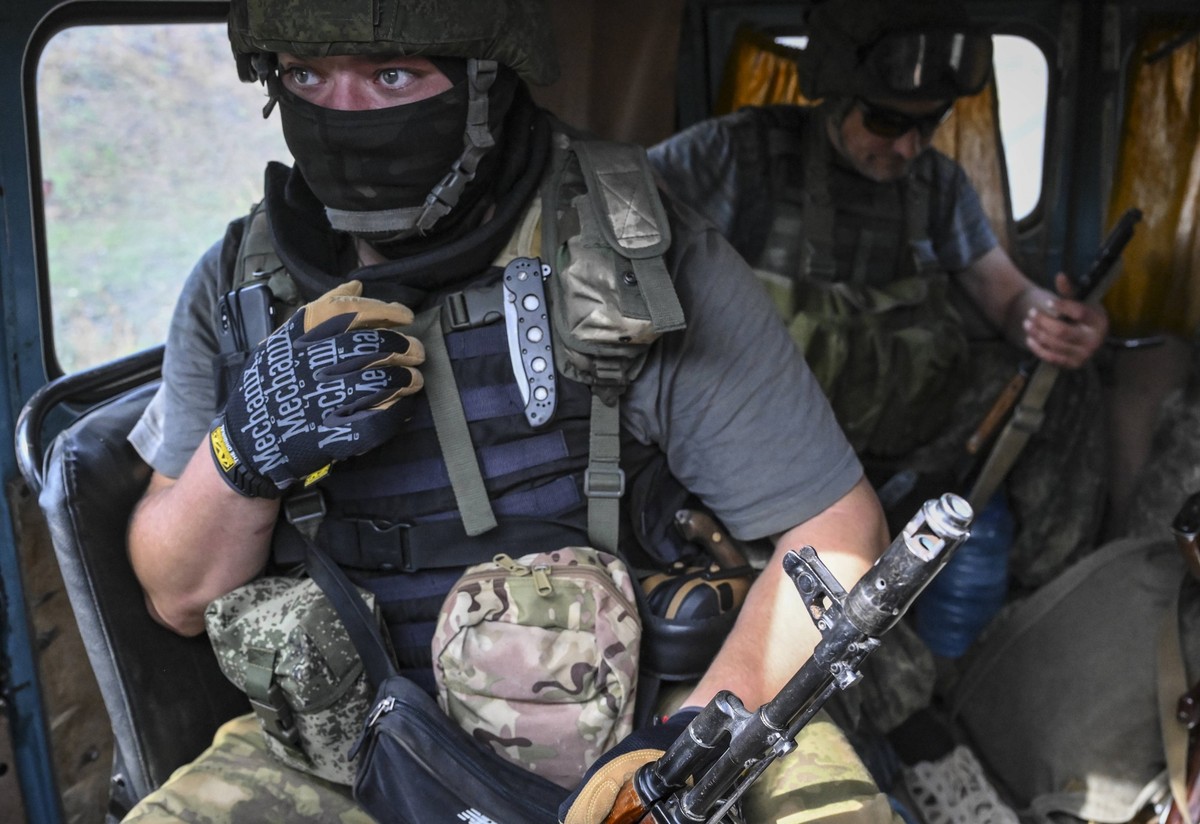 DPR Russia Ukraine Military Operation International Brigade 8252944 14.08.2022 Service members of the Pyatnashka international brigade of pro-Russian troops sit inside a vehicle as Russia s military o ...