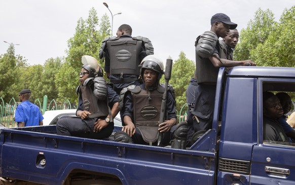 epa09226730 Malian riot police disperse protesters at the Independence square during an attempted protest against the military action in Bamako, Mali, 25 May 2021. The president and prime minister of  ...