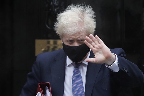 FILE - Britain&#039;s Prime Minister Boris Johnson leaves Downing Street to attend the weekly session of Prime Ministers Questions at Parliament in London, Oct. 21, 2020. For Boris Johnson, facts have ...