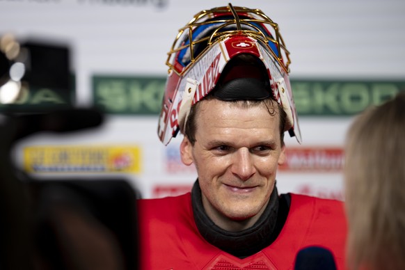 Switzerland's goaltender Leonardo Genoni speaks with journalists in the Mixed Zone after the 2026 IIHF Men's Ice Hockey World Championship Semifinal game between Switzerland and Norway, at t ...