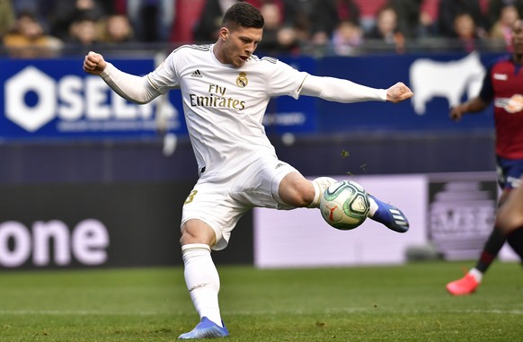 Real Madrid&#039;s Luka Jovic kicks the ball to score during the Spanish La Liga soccer match between Osasuna and Real Madrid at El Sadar stadium in Pamplona, northern Spain, Sunday, Feb. 9, 2020. (AP ...