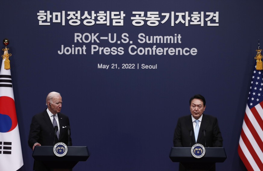 U.S. President Joe Biden, left, attends a joint press conference with South Korean President Yoon Suk Yeol at the presidential office in Seoul Saturday, May 21, 2022. (Jeon Heon-Kyun/Pool Photo via AP ...