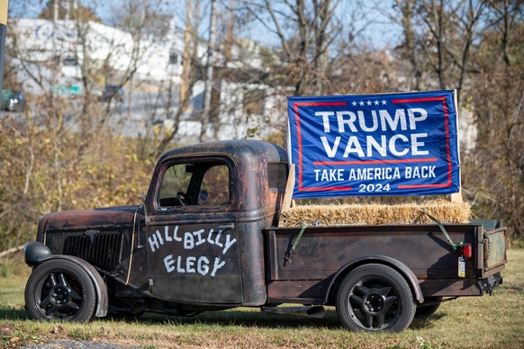 epa11704126 A truck parked in the suburbs of Philadelphia displays a Trump flag and the phrase ?Hillbilly Elegy? on its door as voters across the country cast ballots in the closely contested 2024 U.S ...