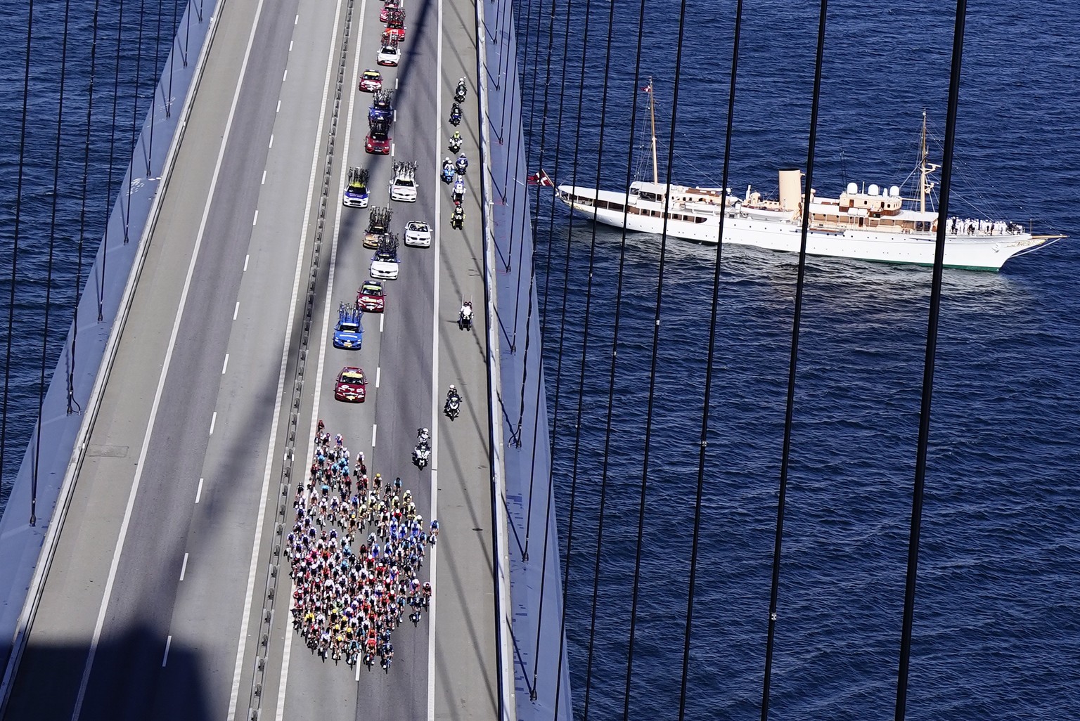epa10047953 Danish Royal Yacht &#039;Dannebrog&#039; sails near the Great Belt Bridge during the second stage of the Tour de France 2022 cycling race, over 202.5km between Roskilde and Nyborg, Denmark ...