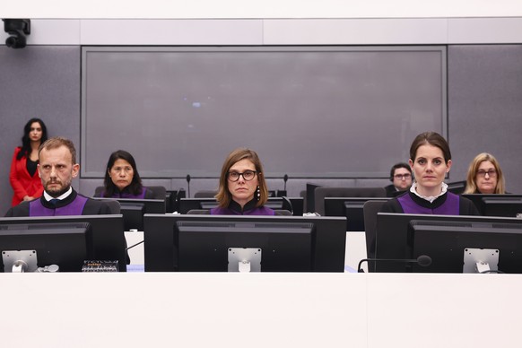 Prosecutors Filippo De Minicis, Gaia Pergolo, and Eva Wyler attend a trial of Former Kosovo Liberation Army (KLA) member Pjeter Shala, at the Kosovo Specialist Chambers in The Hague, Netherlands, Tues ...