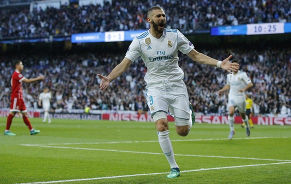 Real Madrid&#039;s Karim Benzema celebrates after scoring his side&#039;s opening goal during the Champions League semifinal second leg soccer match between Real Madrid and FC Bayern Munich at the San ...