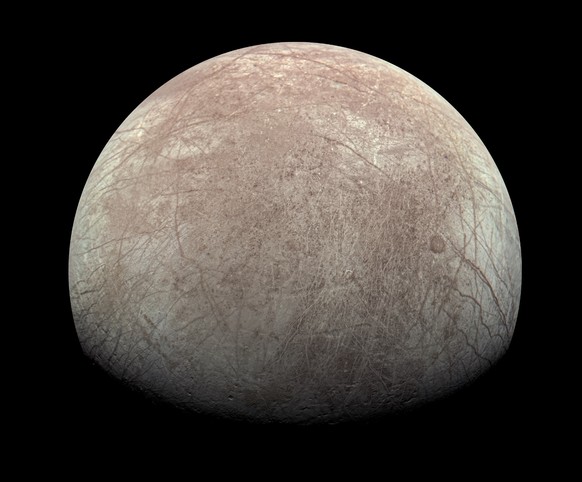 This image provided by NASA, processed by Kevin M. Gill, shows Jupiter&#039;s moon Europa captured by the Juno spacecraft on Sept. 29, 2022, with north to the left. Research published Monday, March 4, ...