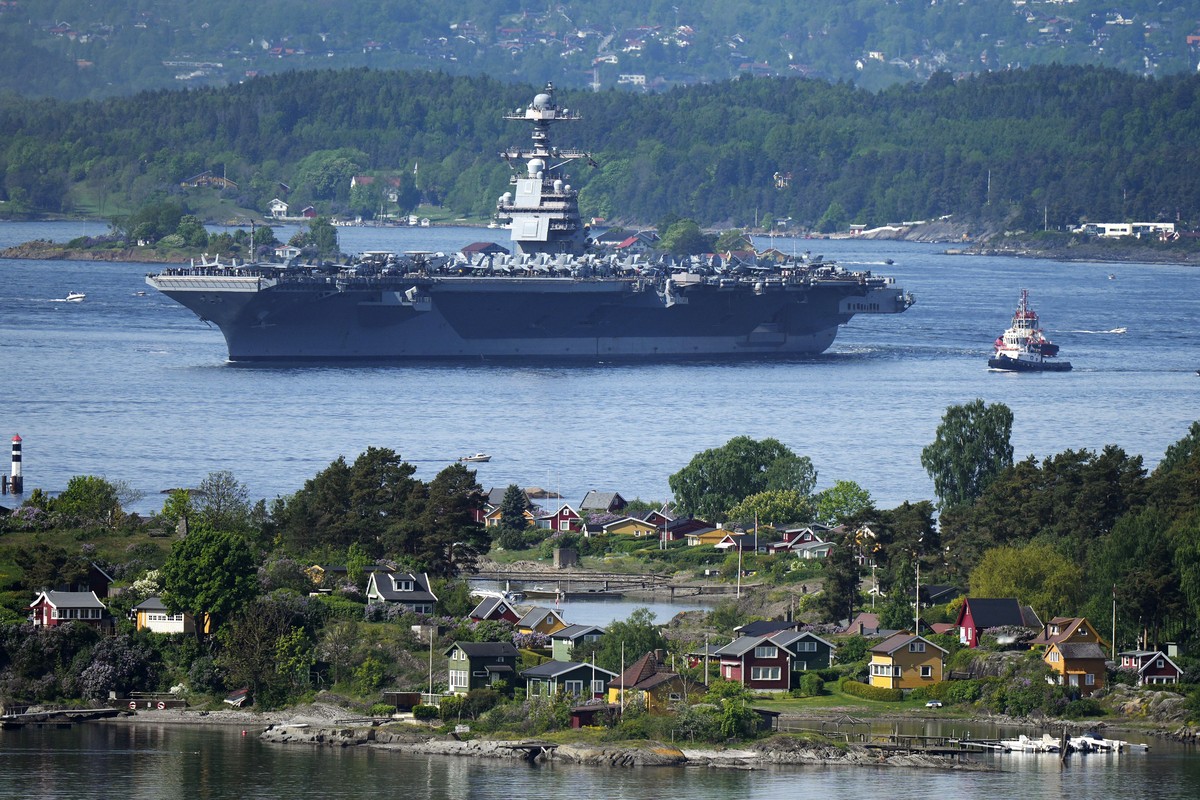The American aircraft carrier USS Gerald R. Ford drives in the Oslo Fjord, Norway, here seen from Ekebergskrenten, Wednesday, May 24, 2023. The ship is the world's largest warship and will be in  ...